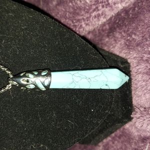 Crystal necklace with turquoise colored stone on 11in chain.